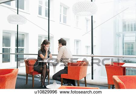 Stock Photograph - Business couple in a restaurant. Fotosearch