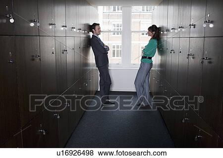 Business couple in locker room View Large Photo Image Stock Photo - Business couple in locker room. Fotosearch