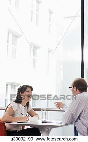 Stock Photo - Business couple working in restaurant. Fotosearch