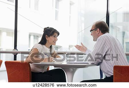 Business couple working in restaurant View Large Photo Image Stock Photograph - Business couple working in restaurant. Fotosearch