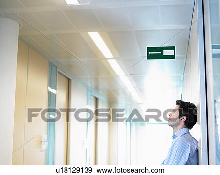 Business man against the wall View Large Photo Image Stock Photo - Business man against the wall. Fotosearch