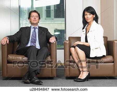 Business man and woman in waiting room View Large Photo Image Stock Photo - Business man and woman in waiting room. Fotosearch