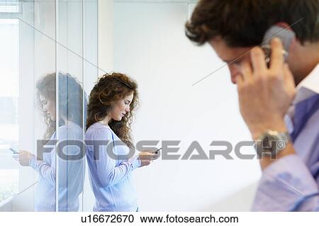 Business man and woman on the phone View Large Photo Image Stock Image - Business man and woman on the phone. Fotosearch