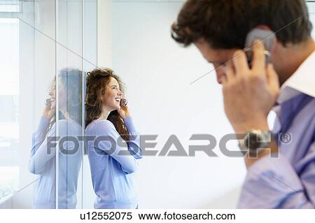 Business man and woman on the phone View Large Photo Image Stock Photography - Business man and woman on the phone. Fotosearch