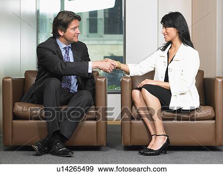 Business man and woman shaking hands View Large Photo Image Stock Photo - Business man and woman shaking hands. Fotosearch