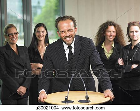 Business man giving a conference View Large Photo Image Picture - Business man giving a conference. Fotosearch
