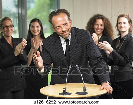 Business man giving a conference View Large Photo Image Stock Image - Business man giving a conference. Fotosearch
