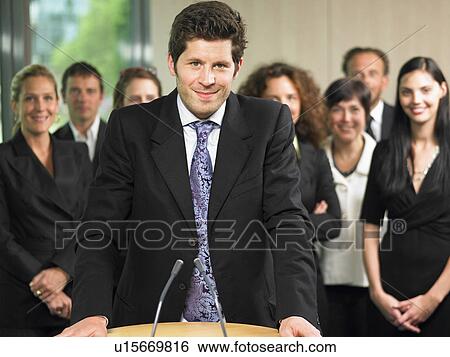 Stock Photograph - Business man giving a conference. Fotosearch