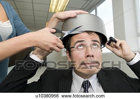 Stock Photograph - Business man having a hair cut. Fotosearch