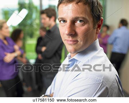 Business man in the office, smiling View Large Photo Image Stock Image - Business man in the office, smiling. Fotosearch