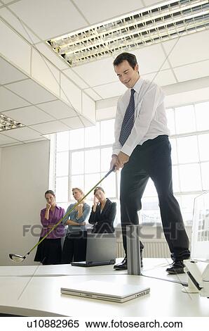 Stock Photography - Business man playing golf. Fotosearch