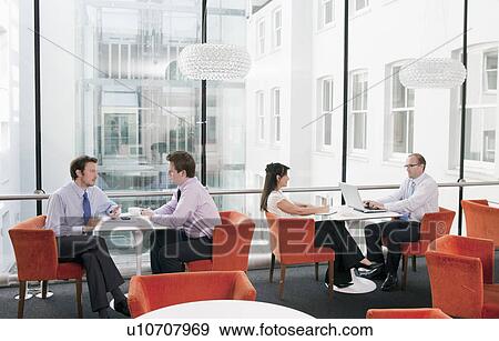 Stock Photo - Business meetings in a restaurant. Fotosearch