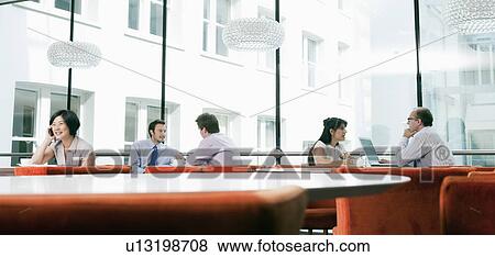 Business people in a restaurant View Large Photo Image Stock Photo - Business people in a restaurant. Fotosearch