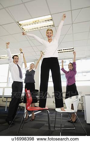 Stock Photo - Business team celebrating. Fotosearch