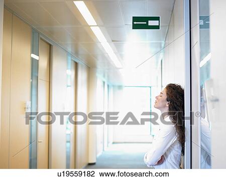 Business woman against the wall View Large Photo Image Stock Image - Business woman against the wall. Fotosearch