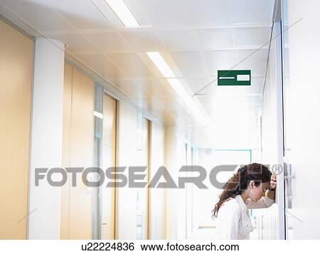 Stock Photograph - Business woman against the wall. Fotosearch