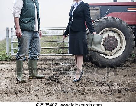 business woman at muddy farm View Large Photo Image Stock Image - business woman at muddy farm. Fotosearch