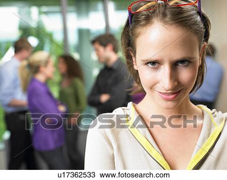 Business woman in the office, smiling View Large Photo Image Stock Image - Business woman in the office, smiling. Fotosearch