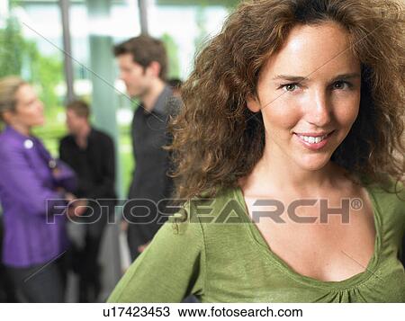 Business woman in the office, smiling View Large Photo Image Stock Image - Business woman in the office, smiling. Fotosearch