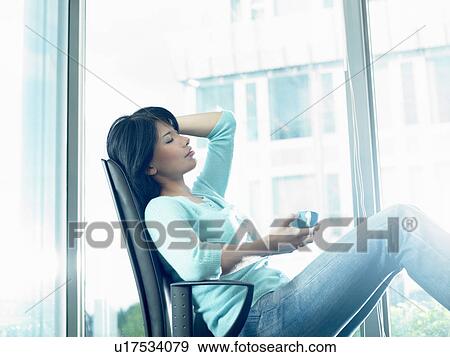 Stock Photo - Business woman on her coffee break. Fotosearch