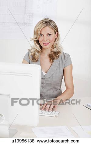 Stock Photo - Business woman on the computer. Fotosearch