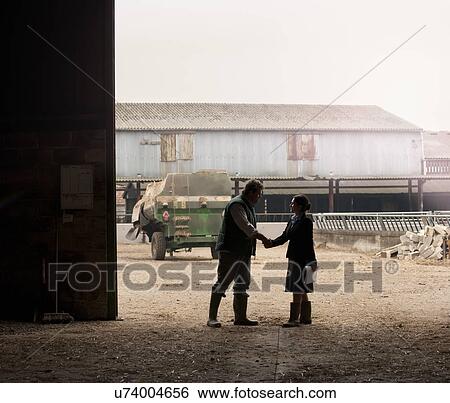 business woman shaking hands with farmer View Large Photo Image Stock Photograph - business woman shaking hands with farmer. Fotosearch