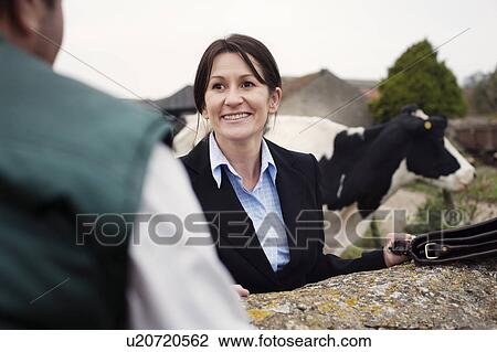 business woman talking to farmer View Large Photo Image Stock Image - business woman talking to farmer. Fotosearch