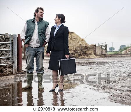 business woman talking to farmer View Large Photo Image Stock Photo - business woman talking to farmer. Fotosearch