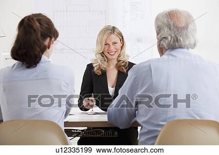 Business woman talking to man and woman. View Large Photo Image Stock Photo - Business woman talking to man and woman.. Fotosearch