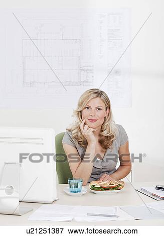 Stock Photo - Business woman with healthy lunch.. Fotosearch