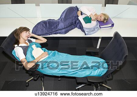 Business women sleeping in the office View Large Photo Image Stock Photograph - Business women sleeping in the office. Fotosearch