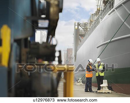 Businessman And Port Worker With Ship View Large Photo Image Stock Image - Businessman And Port Worker With Ship. Fotosearch