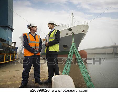 Businessman And Port Worker With Ship View Large Photo Image Stock Photograph - Businessman And Port Worker With Ship. Fotosearch