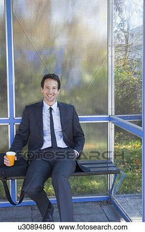 businessman at bus stop, waiting, happy View Large Photo Image Stock Image - businessman at bus stop, waiting, happy. Fotosearch