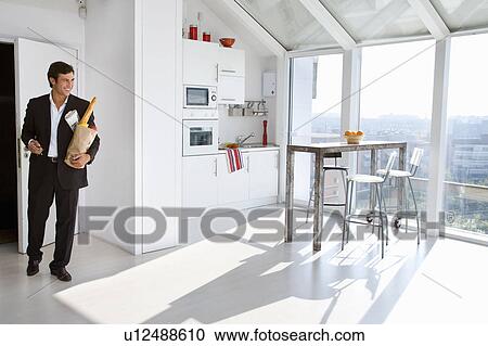 Businessman at home View Large Photo Image Stock Image - Businessman at home. Fotosearch