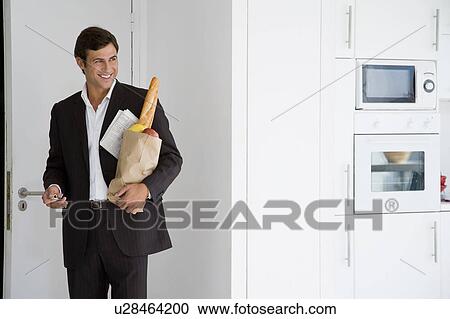 Businessman at home View Large Photo Image Stock Image - Businessman at home. Fotosearch