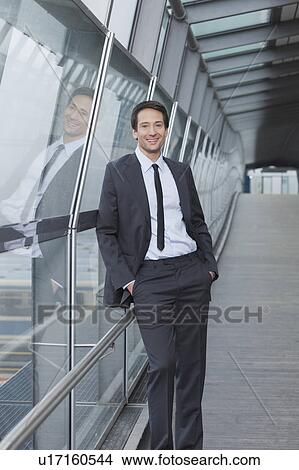 businessman at window pane, total view View Large Photo Image Picture - businessman at window pane, total view. Fotosearch