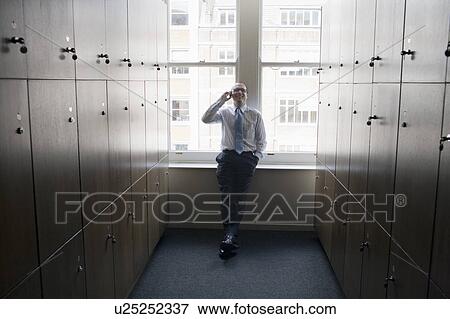 Stock Photo - Businessman in a locker room. Fotosearch