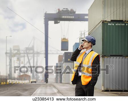 Businessman In Port With Containers View Large Photo Image Stock Image - Businessman In Port With Containers. Fotosearch