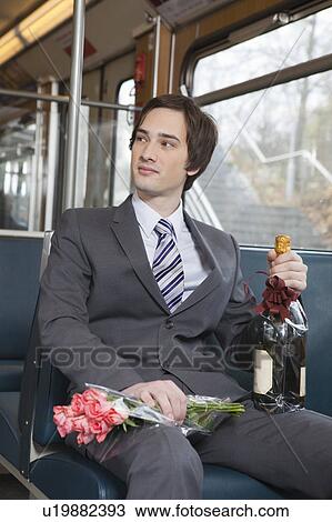 businessman in tube, champagne, flowers View Large Photo Image Stock Image - businessman in tube, champagne, flowers. Fotosearch