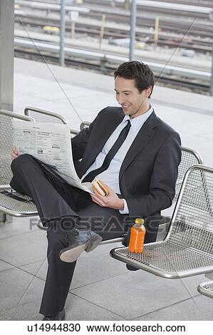 businessman on bench, with newspaper View Large Photo Image Stock Image - businessman on bench, with newspaper. Fotosearch