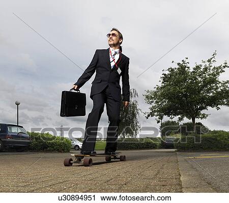 businessman on skateboard View Large Photo Image Stock Image - businessman on skateboard. Fotosearch