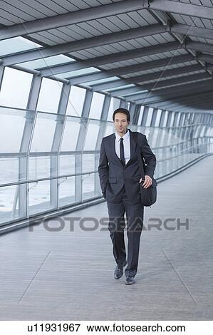 businessman walking in skywalk View Large Photo Image Stock Photo - businessman walking in skywalk. Fotosearch