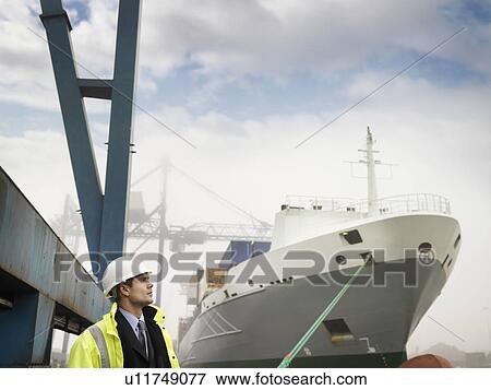 Businessman With Container Ship View Large Photo Image Stock Photo - Businessman With Container Ship. Fotosearch