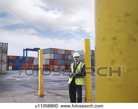 Businessman With Shipping Containers View Large Photo Image Stock Image - Businessman With Shipping Containers. Fotosearch
