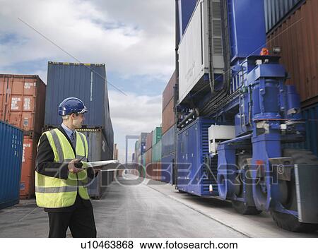 Businessman With Shipping Containers View Large Photo Image Stock Photo - Businessman With Shipping Containers. Fotosearch