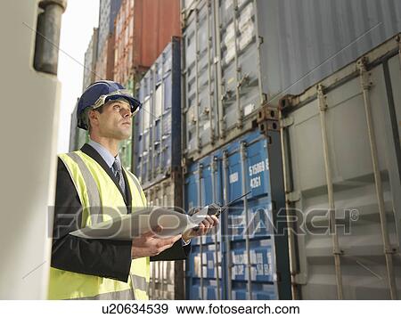 Businessman With Shipping Containers View Large Photo Image Stock Photo - Businessman With Shipping Containers. Fotosearch