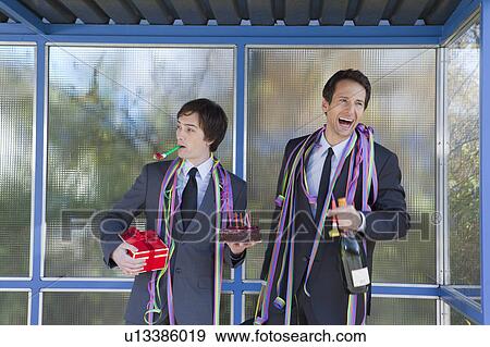 businessmen at bus stop, with party set View Large Photo Image Stock Photo - businessmen at bus stop, with party set. Fotosearch