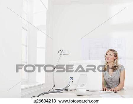 Businesswoman daydreaming View Large Photo Image Stock Image - Businesswoman daydreaming. Fotosearch