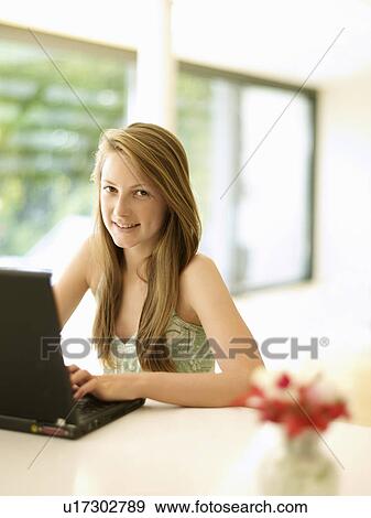 cheerful teenage girl with laptop View Large Photo Image Stock Photo - cheerful teenage girl with laptop. Fotosearch